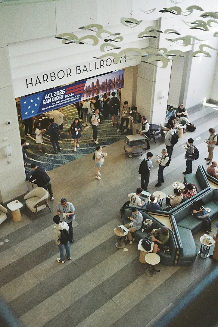 Academics gathered under the conference banner at ACL 2026, competing for corporate giveaways