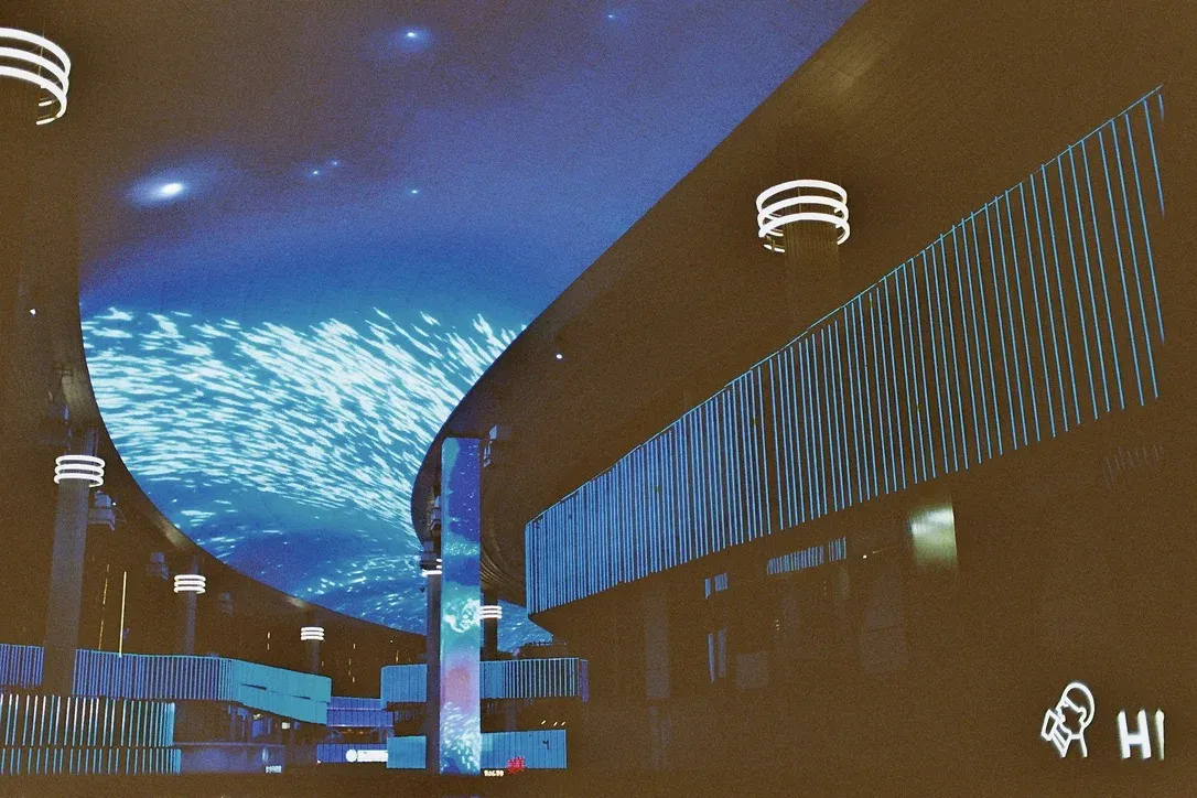 Bridge with LED panel ceiling displaying animations and advertisements in Suzhou
