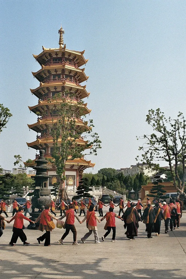 Local religious community performing ritual ceremony in the front of a pagoda